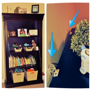 My son's bookcase secured to the wall.