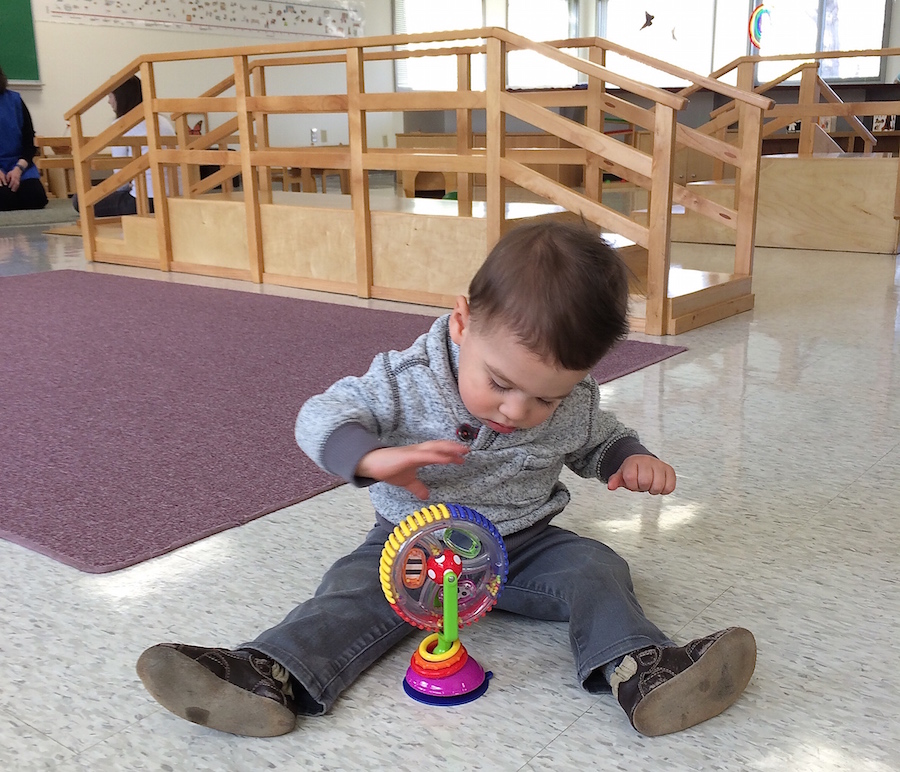 A throwback to Nicolas completely engaged in a single toy in his school playgroup. 