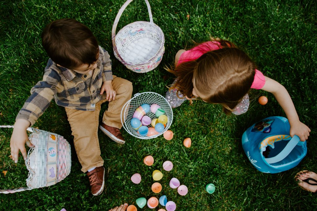 kids and Easter baskets in the grass, easter basket gift ideas