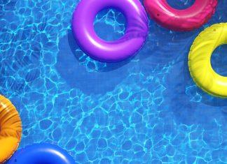 view from above of swimming pool with colorful inner tubes