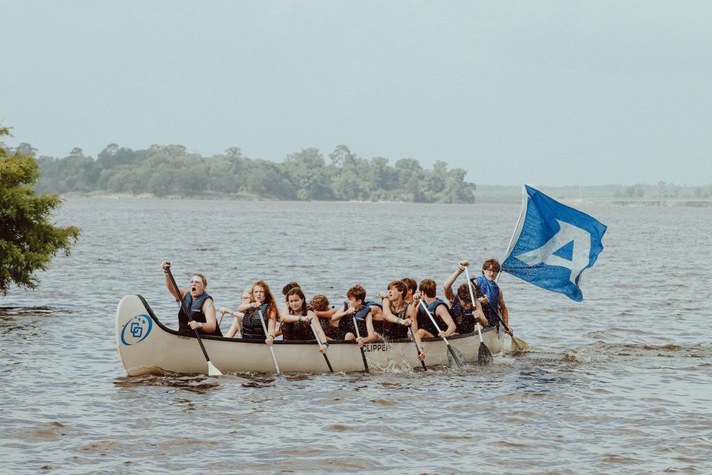 campers in a canoe at Camp Olympia