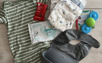 What I actually carry in my bag: diapers, wipe, snack, onesie, toy, book, bib