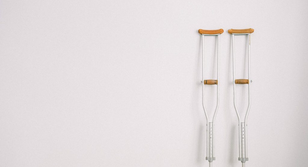 crutches on white wall, pregnancy hip dysplasia
