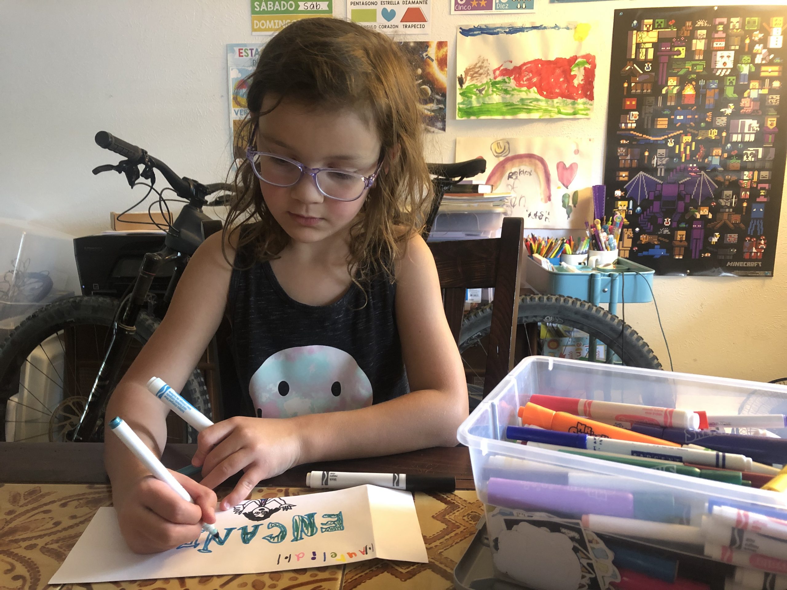 girl coloring her creative art projects for kids