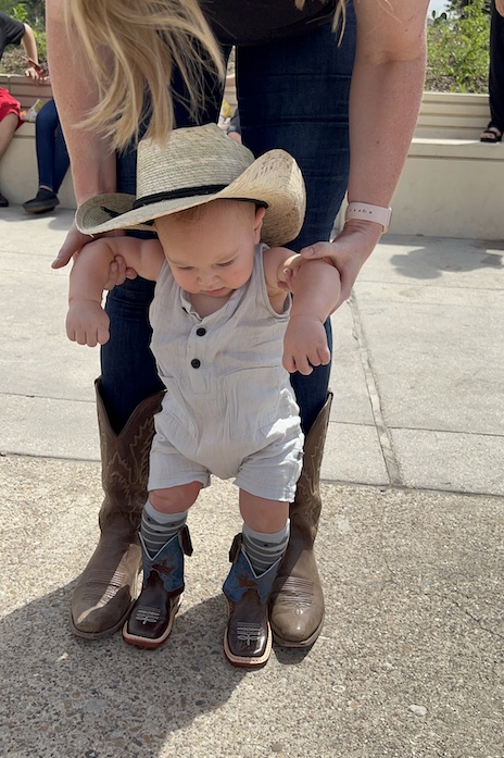 baby in cowboy boots and cowboy hat at the state fair