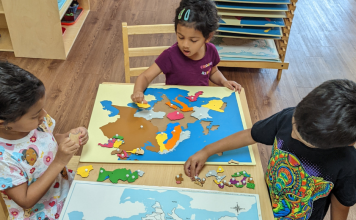 kids doing a puzzle at Wonderland Montessori