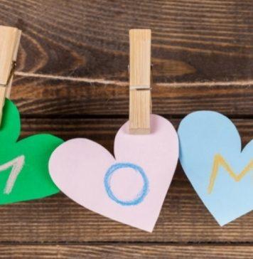 Three hearts, cut out of construction paper, hang on a clothes pins and spell "mom" written in crayon.