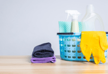 Cleaning supplies such as rubber gloves, multipurpose solution, and towels.