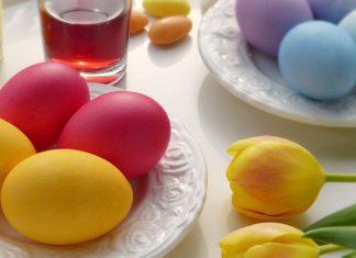 dyed easter eggs and tulips on table