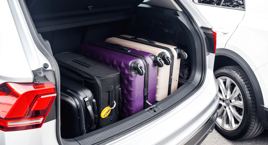 Luggage in the back of a car.