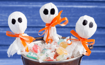 Lollipop ghosts in a bucket of candy.