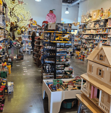 Toy Tree store in Plano with dollhouse and train set and toys displayed.