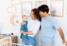 A mother and father in their baby's nursery with a Harbor baby monitor camera